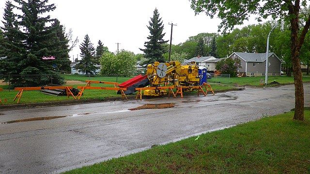 Directional drilling machine installing new sewer line under street