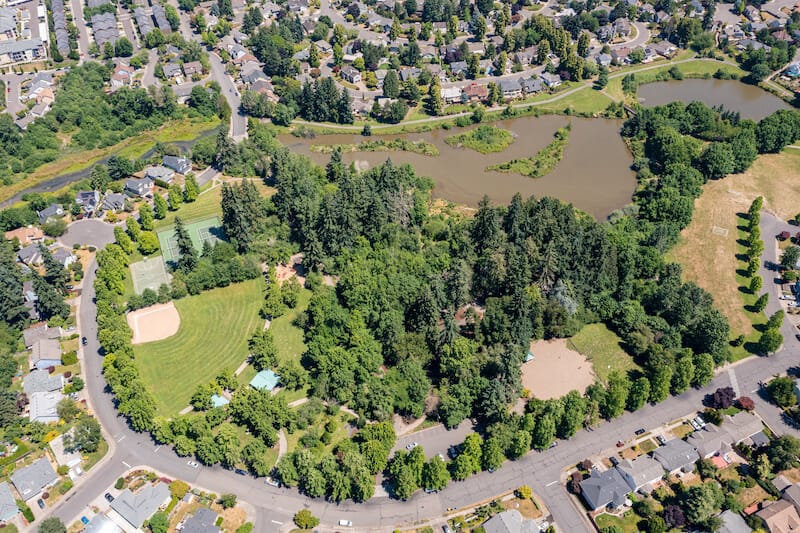 Tigard Homes Aerial View with Green Trees and Lawn
